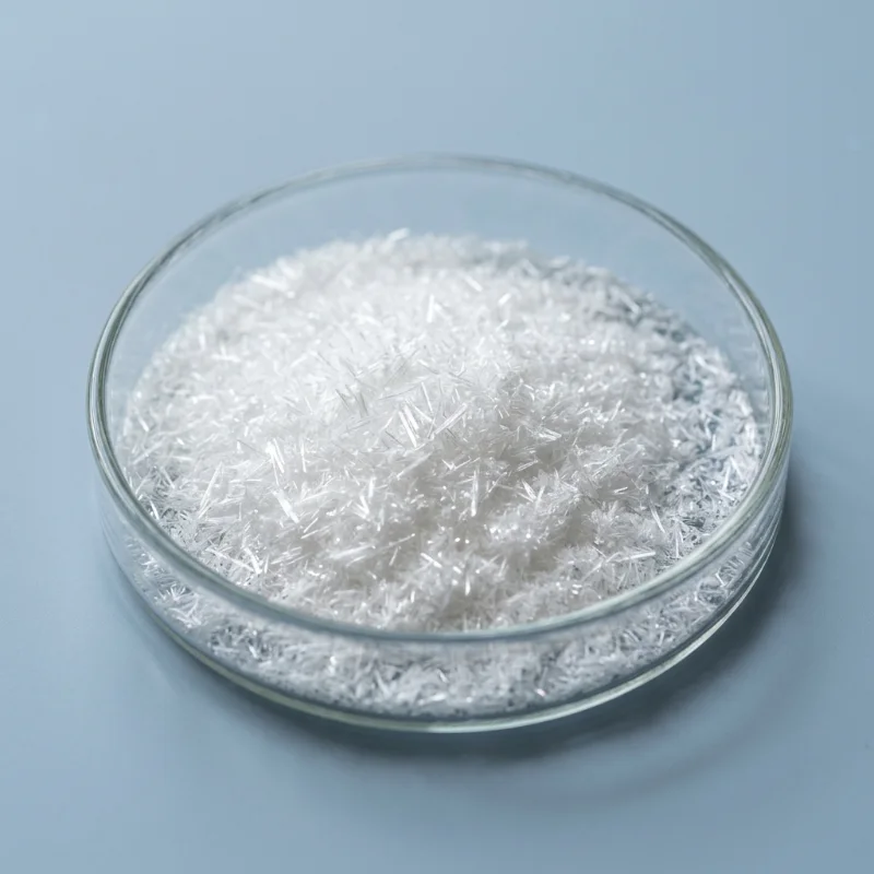 Fine white salicylic acid crystals in a glass petri dish